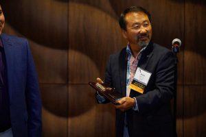 Dr. Kevin Lee accepts plaque as the 2018 Florida Urological Society President.