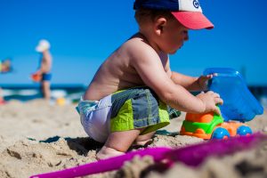 child playing in sand