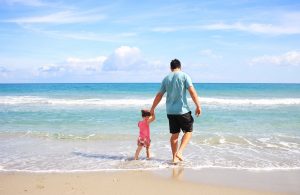 dad and child on beach