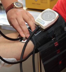 checking blood pressure